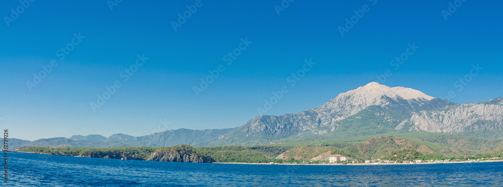 Naklejka premium Mountains on the sea in summer