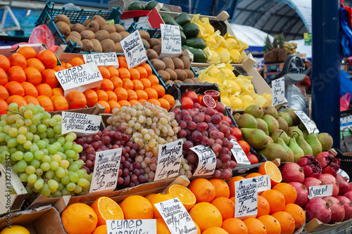Fruit market with various colorful fresh fruits and vegetables. Healthy food concept. Vitamins and minerals. © 8th
