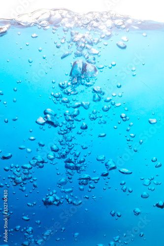 Bubbles in the blue water. Clear transparent water in underwater photography. Background.