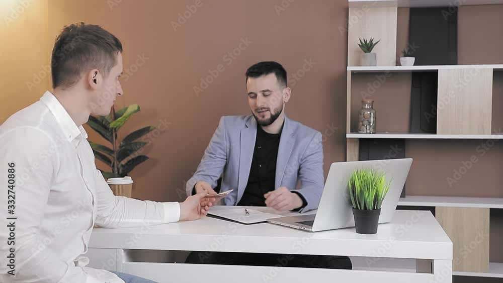 client offers a bribe to an employee of the company in the office. The Manager of the company refuses the bribe showing the refusal with his hands client offers a bribe to an employee of the company in the office. The Manager of the company refuses the bribe showing the refusal with his hands