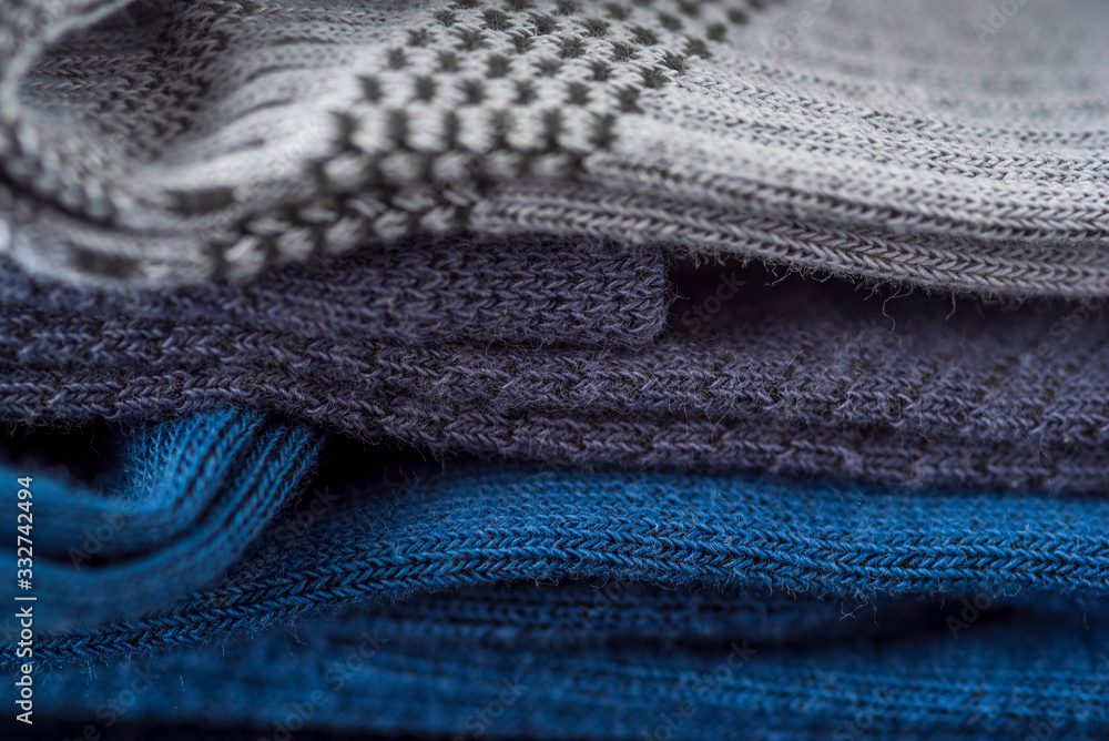 Men's socks. Photographed close-up against a dark background. Men's socks. Photographed close-up against a dark background.