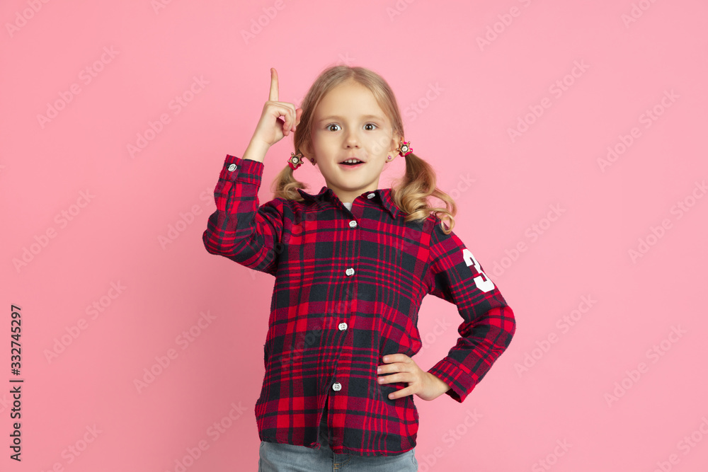 Thoughtful, have an idea. Caucasian little girl's portrait on pink studio background. Beautiful female model with blonde hair. Concept of human emotions, facial expression, sales, ad, youth, childhood Thoughtful, have an idea. Caucasian little girl's portrait on pink studio background. Beautiful female model with blonde hair. Concept of human emotions, facial expression, sales, ad, youth, childhood