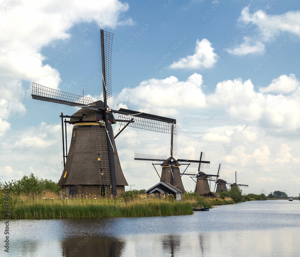 Kinderdijk, Rotterdam, NETHERLANDS -  Netherlands rural lanscape with windmills at famous tourist site Kinderdijk in Holland. Old Dutch village Kinderdijk, UNESCO world heritage site.