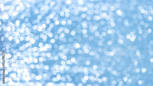Abstract light blue background with white bokeh_