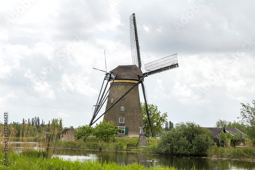 Kinderdijk, Rotterdam, NETHERLANDS: Netherlands rural lanscape with windmills at famous tourist site Kinderdijk in Holland. Old Dutch village Kinderdijk, UNESCO world heritage site.