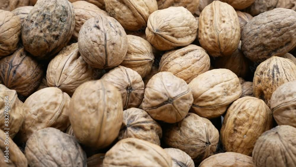 Fresh walnuts put in the basket, slow motion HD, march 2020 Fresh walnuts put in the basket, slow motion HD, march 2020