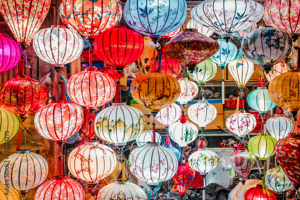 Traditional colorful lanterns spread light on the old street of Hoi An Ancient Town - UNESCO World Heritage Site. Vietnam in 2019.