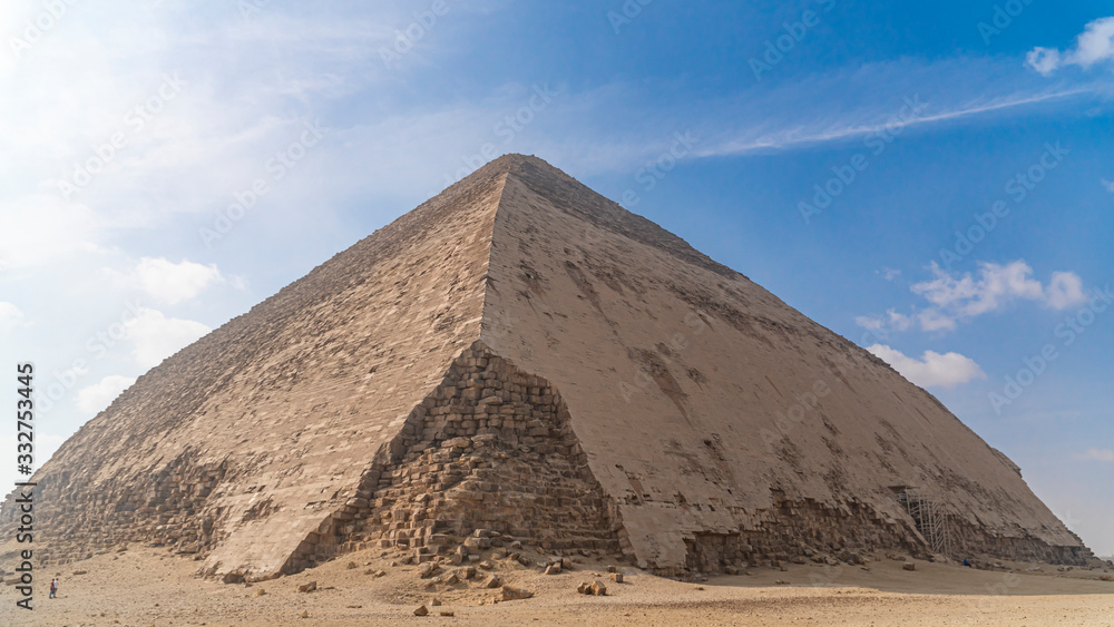 The Bent Pyramid is an ancient Egyptian pyramid located at the royal necropolis of Dahshur, approximately 40 kilometres south of Cairo, built under the Old Kingdom Pharaoh Sneferu. Egypt The Bent Pyramid is an ancient Egyptian pyramid located at the royal necropolis of Dahshur, approximately 40 kilometres south of Cairo, built under the Old Kingdom Pharaoh Sneferu. Egypt