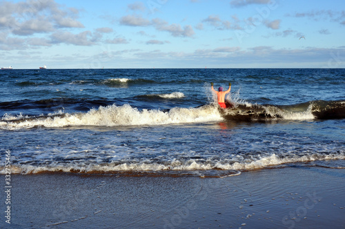 People bathe in the cold Baltic sea in winter, harden their bodies so that they don't get sick and be energetic.