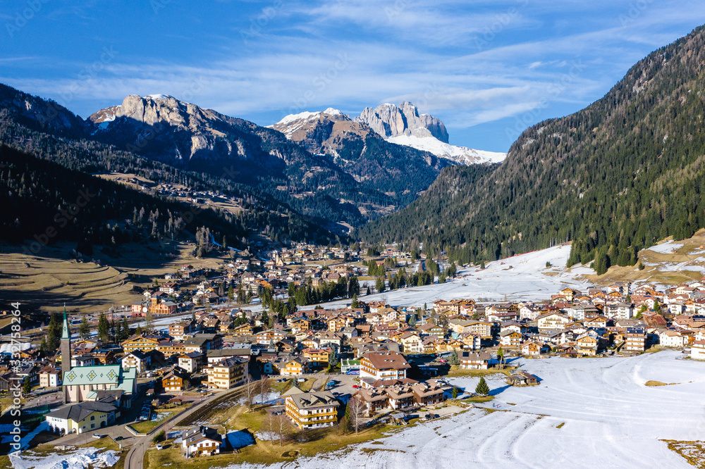 Winter aerial view of Pozza di Fassa, a commune in Trentino at the northern Italia. Val di Fassa, Dolomiti
