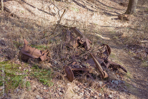 automobile remains in the woods