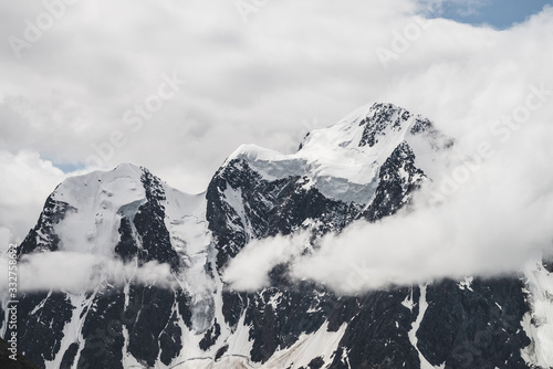 Slika na platnu Atmospheric minimalist alpine landscape with massive hanging glacier on snowy mountain peak