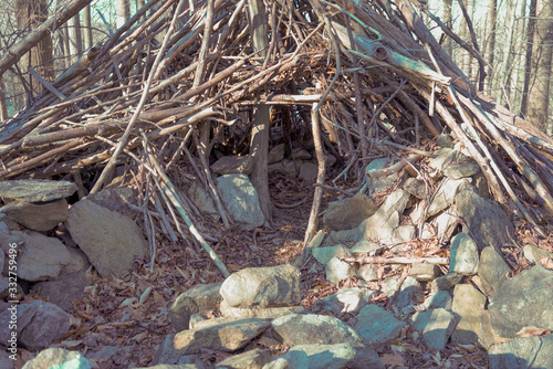 survival shelter in the woods entrance 