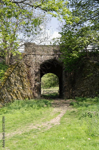 Fototapeta Naklejka Na Ścianę i Meble -  Footpath under railway bridge, Hathersage Derbyshire England