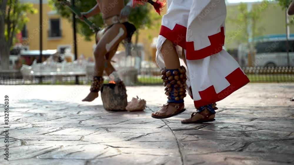 Closeup slow motion of angle jangles worn by Mayan and Aztec dancers in a park in Valladolid, Yucatan, Mexico. Closeup slow motion of angle jangles worn by Mayan and Aztec dancers in a park in Valladolid, Yucatan, Mexico.