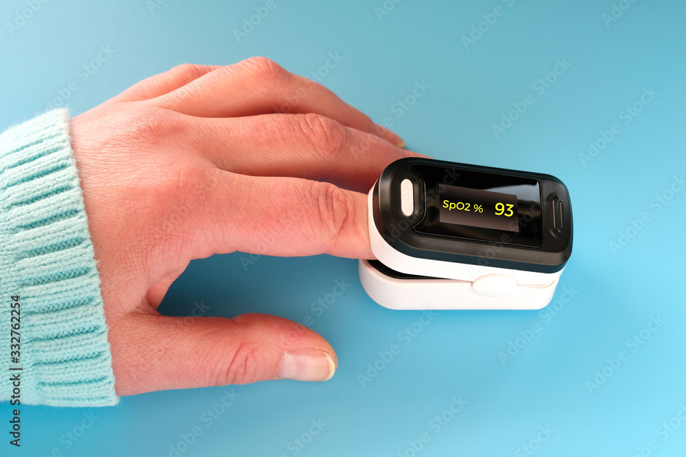 Pulse Oximeter portable digital device to measure person's oxygen saturation. Reduction in oxygenation is an emergency sign of Covid-19 viral pneumonia requiring immediate hospitalization. Pulse Oximeter portable digital device to measure person's oxygen saturation. Reduction in oxygenation is an emergency sign of Covid-19 viral pneumonia requiring immediate hospitalization.
