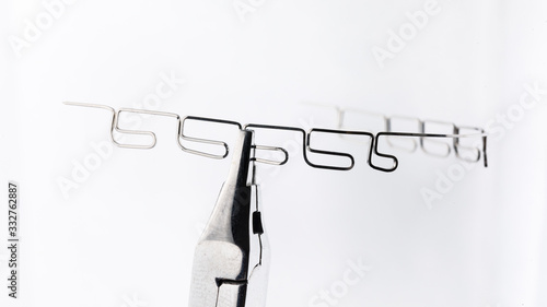 steel orthodontic arch on a white background photo