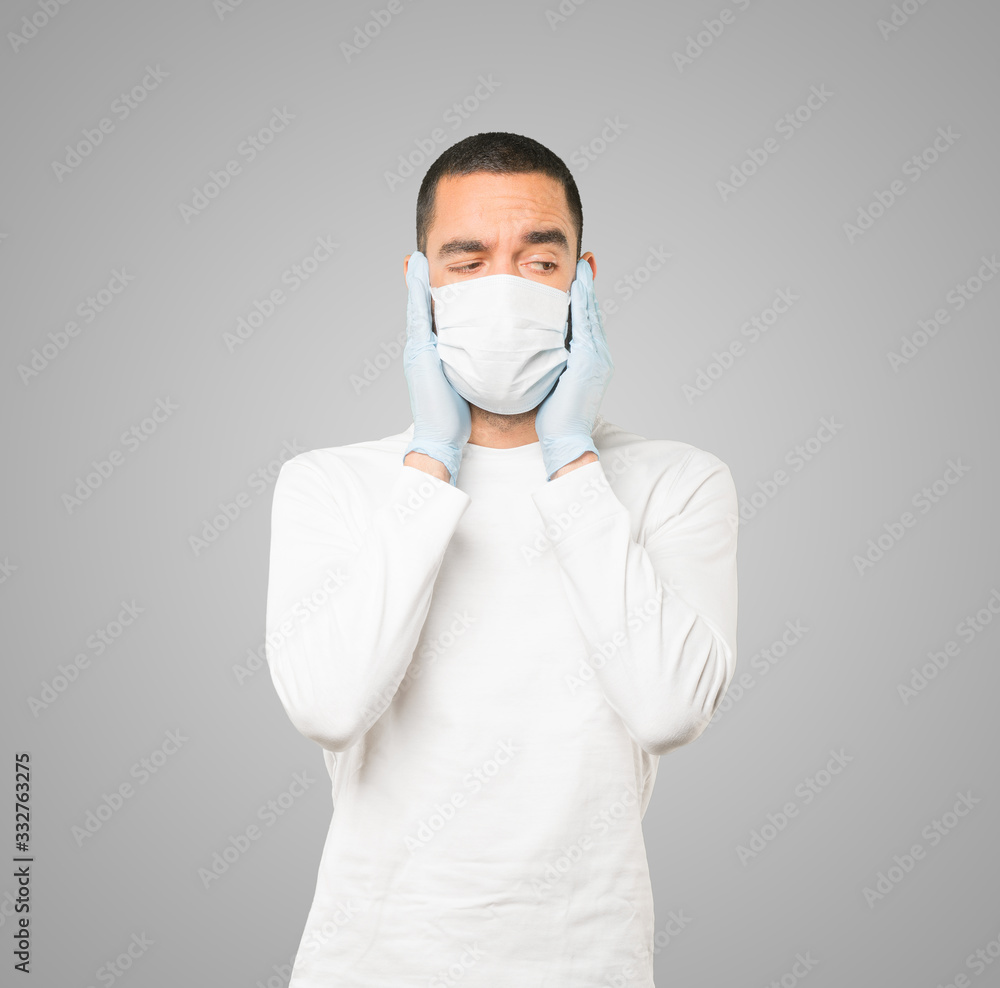 Coronavirus.Young man doing concepts and wearing mask and protective gloves Coronavirus.Young man doing concepts and wearing mask and protective gloves
