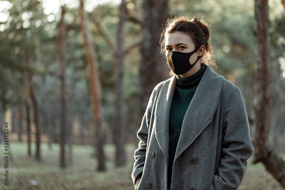 asian woman in medical mask. a girl in a protective mask that protects against viruses asian woman in medical mask. a girl in a protective mask that protects against viruses