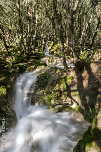 Ses fonts Ufanes in Mallorca a roaring stream that rushes down the mountain. photo