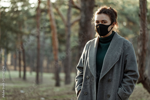 asian woman in medical mask. a girl in a protective mask that protects against viruses © darakaliton