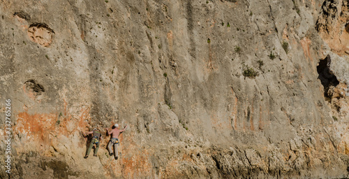 Mallorca, Spain, February 29th 2020: climbers climbing a rock wall at Cala Magraner