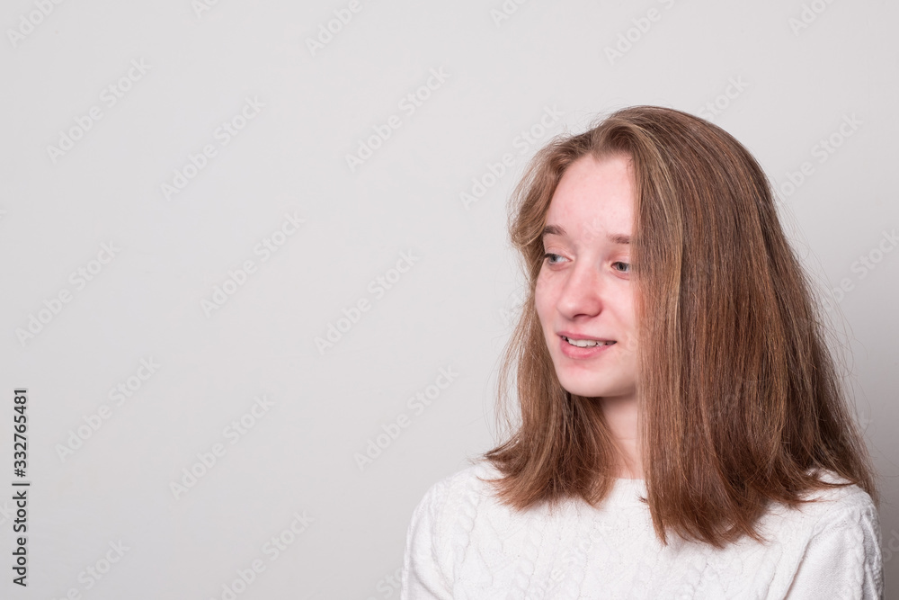 Fototapeta premium Smiling young girl. Positive caucasian teen girl.