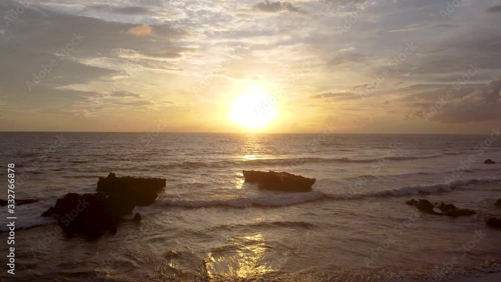sunset in bali the waves are breaking on the beach the sky is very beautiful sunset in bali the waves are breaking on the beach the sky is very beautiful