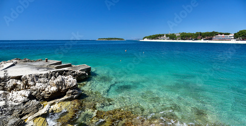 Fototapeta Naklejka Na Ścianę i Meble -  Landscape of blue Adriatic lagoon - view from the boardwalk in Promestein, Dalmatia, Croatia