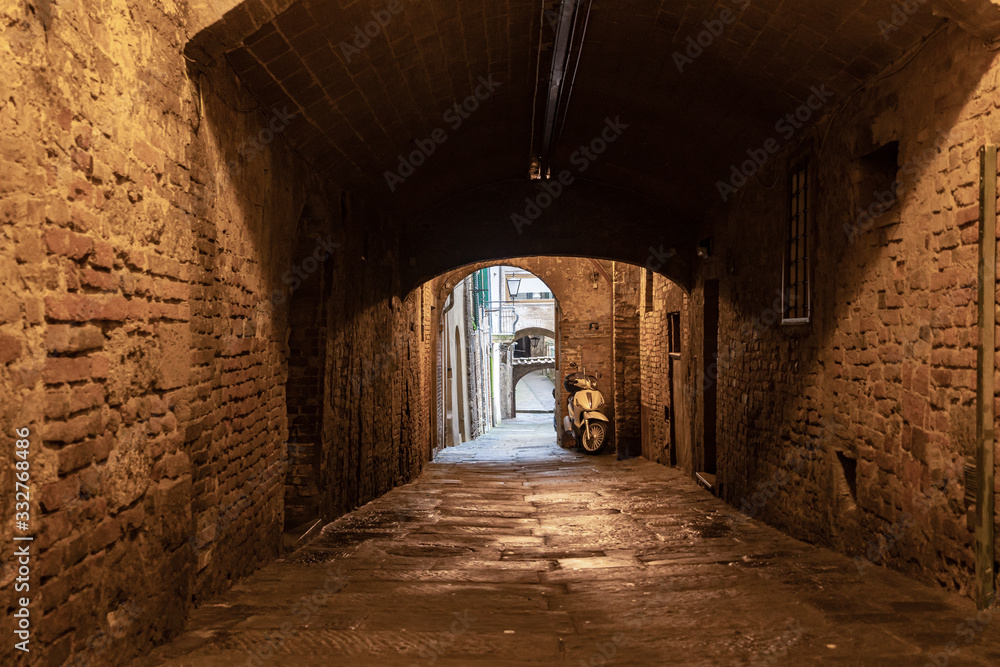 Old italian city, empty street of North italy town at pandemia in Europe