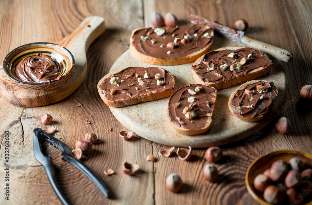 Sandwiches with chocolate cream on wood. Sandwiches with chocolate cream on wood.