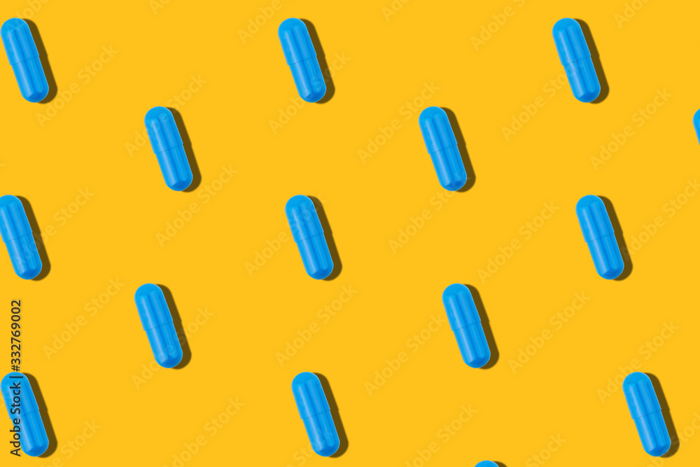 Seamless pattern with blue pills on a yellow background. Seamless pattern with blue pills on a yellow background.