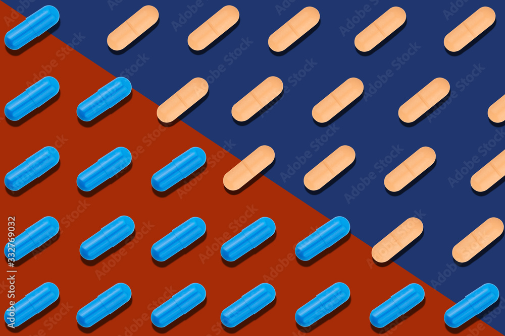 Seamless pattern with blue and orange pills on red and blue background. Seamless pattern with blue and orange pills on red and blue background.