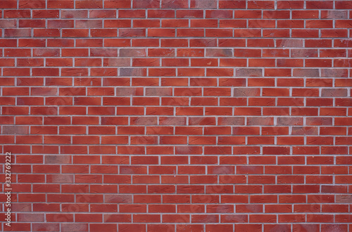 Red burned brick wall background