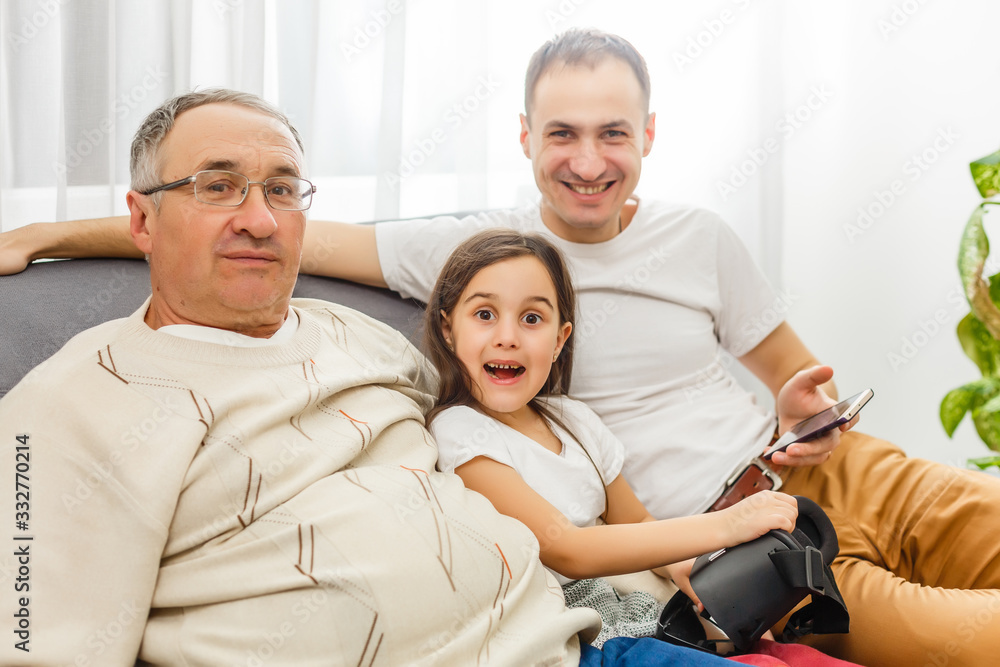 Obraz premium father, son and granddaughter at home