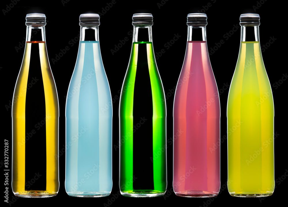 Five bottles of carbonated lemonade in various colors Five bottles of carbonated lemonade in various colors