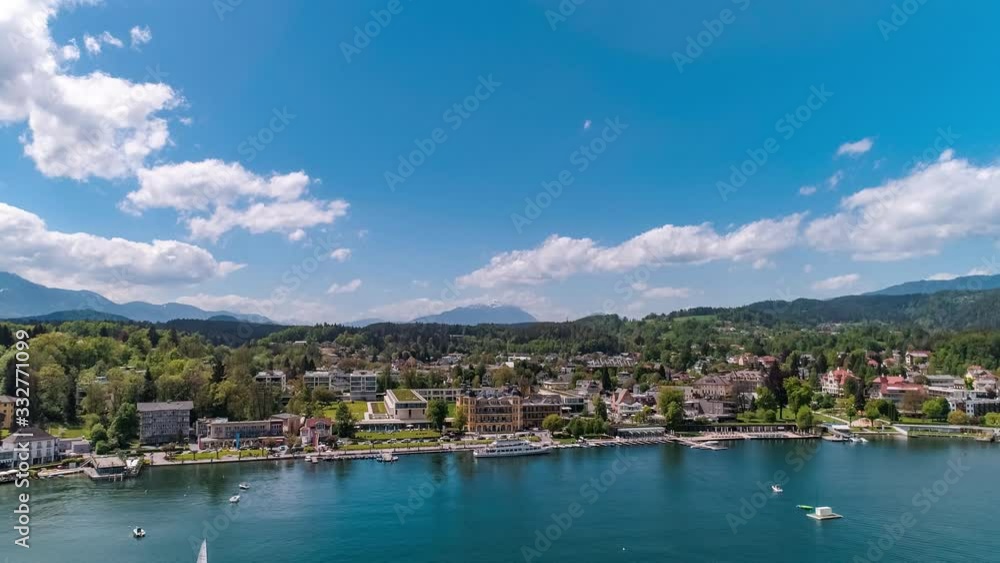Aerial drone view of hotel Falkensteiner Schlosshotel Velden Am Worthersee lake and cruise ship, mountain view on a sunny day in Austria
Aerial drone view of hotel Falkensteiner Schlosshotel Velden Am Worthersee lake and cruise ship, mountain view on a sunny day in Austria