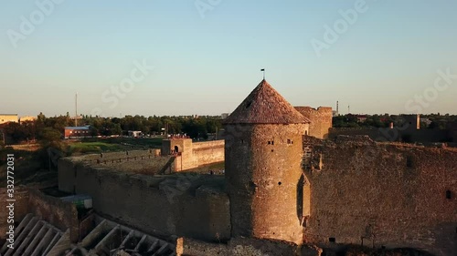 aerial View of fortress at sunset over the sea, aerial view of Akerman Fortress at sunset, Flying on drone over ancient fortress Akkerman which is on the bank of the Dniester estuary in Bilhorod photo