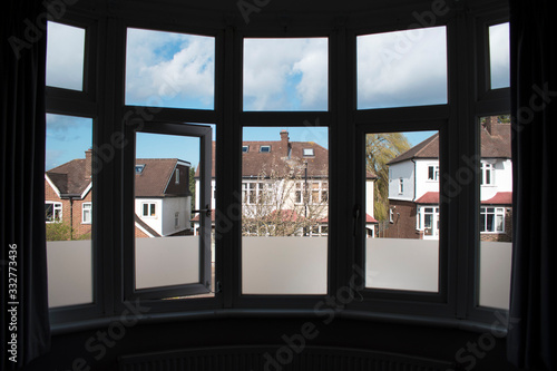 Suburban view from a large English bay window in London 