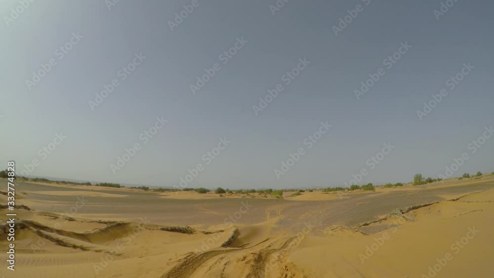 POV Camera car in the sahara desert off road driving. Part of Paris - Dakar route near Merzouga village in Morocco POV Camera car in the sahara desert off road driving. Part of Paris - Dakar route near Merzouga village in Morocco