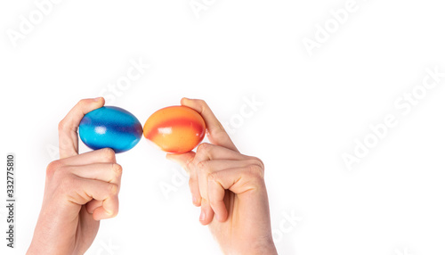 colored eggs with hands tapping and crushing eggs