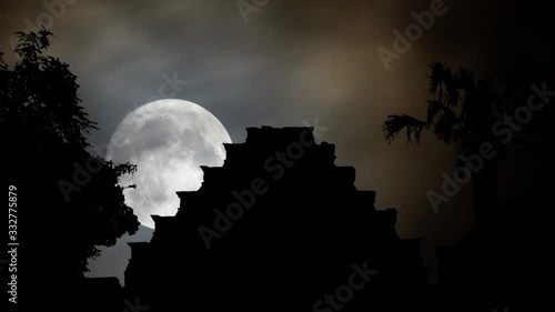 Pyramid De Los Nidos in Tajn, Time Lapse by Night with Full Moon and silhouette of Maya Temple, Veracruz, Mexico photo