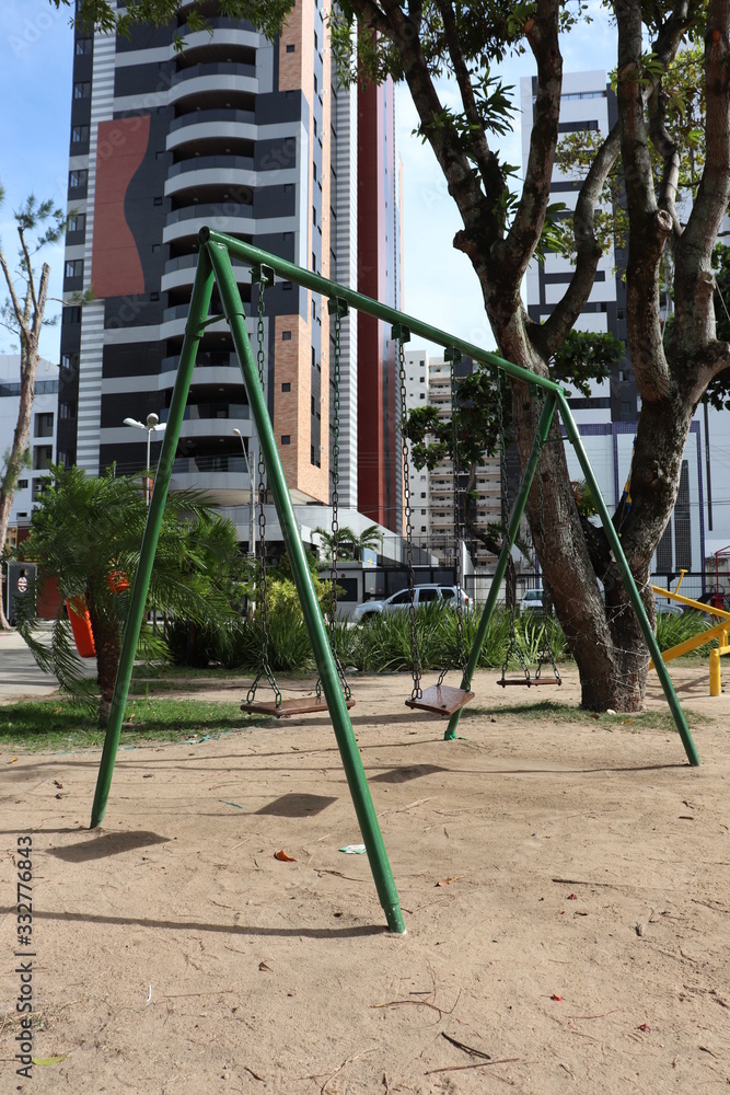Fototapeta premium Swing in playground at Jose Barreto square in Maceio Brazil