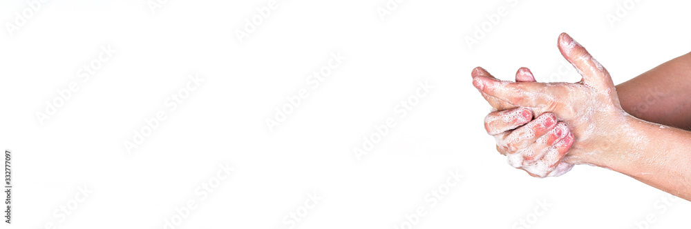 Young man washing hands with soap, wide banner space for text left side, isolated on white. Can be used during coronavirus covid19 outbreak prevention Young man washing hands with soap, wide banner space for text left side, isolated on white. Can be used during coronavirus covid19 outbreak prevention