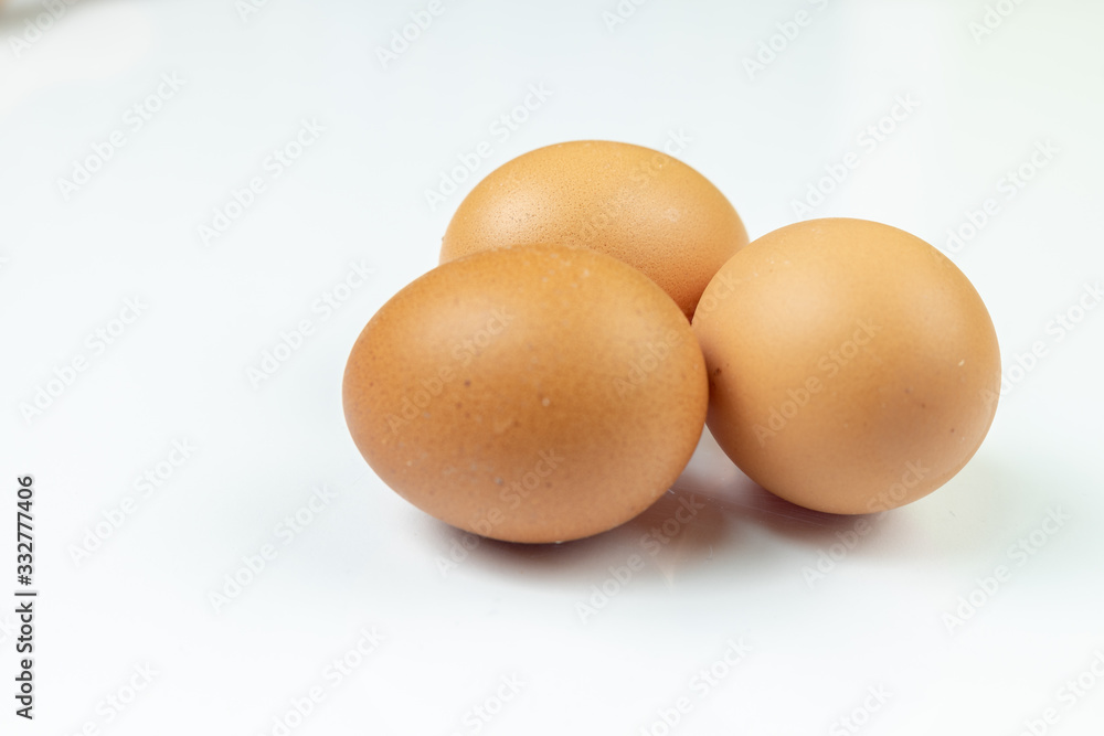 Three Chicken Eggs Isolated Above White Background Three Chicken Eggs Isolated Above White Background