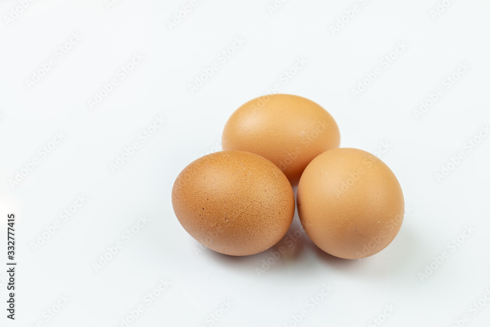 Three Chicken Eggs Isolated Above White Background Three Chicken Eggs Isolated Above White Background