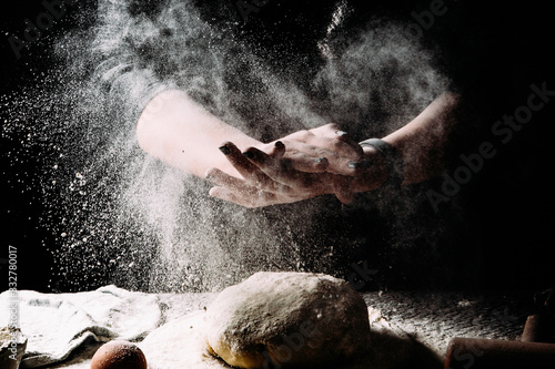 Flour.Cooking the dough. Photograph in a dark vein. 