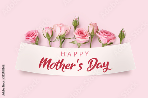 Mother's day greeting card with blossom flowers. Rose flowers on pink background. Studio shot of pink rosebuds. Happy Mothers Day.