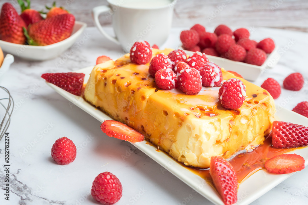 Condensed milk flan with raspberries and strawberries. Condensed milk flan with raspberries and strawberries.