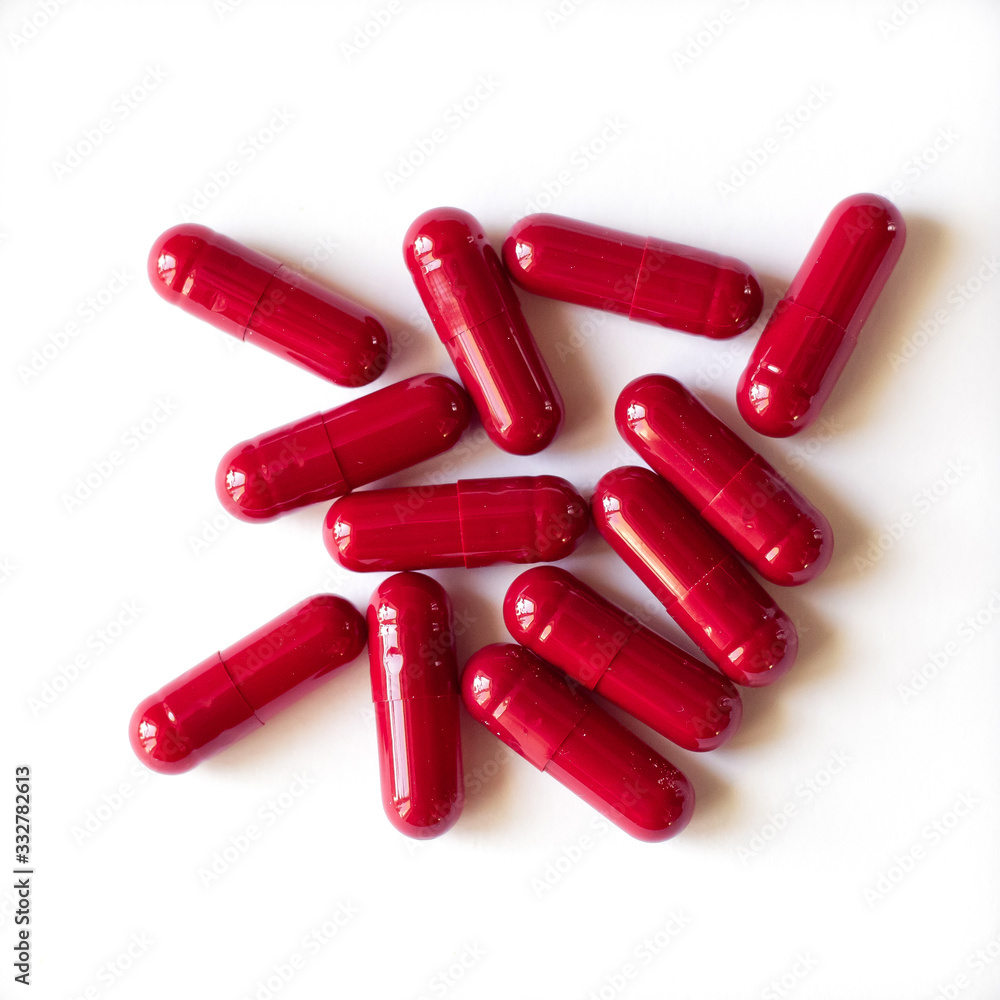 red medical capsules on a white background, isolate red medical capsules on a white background, isolate